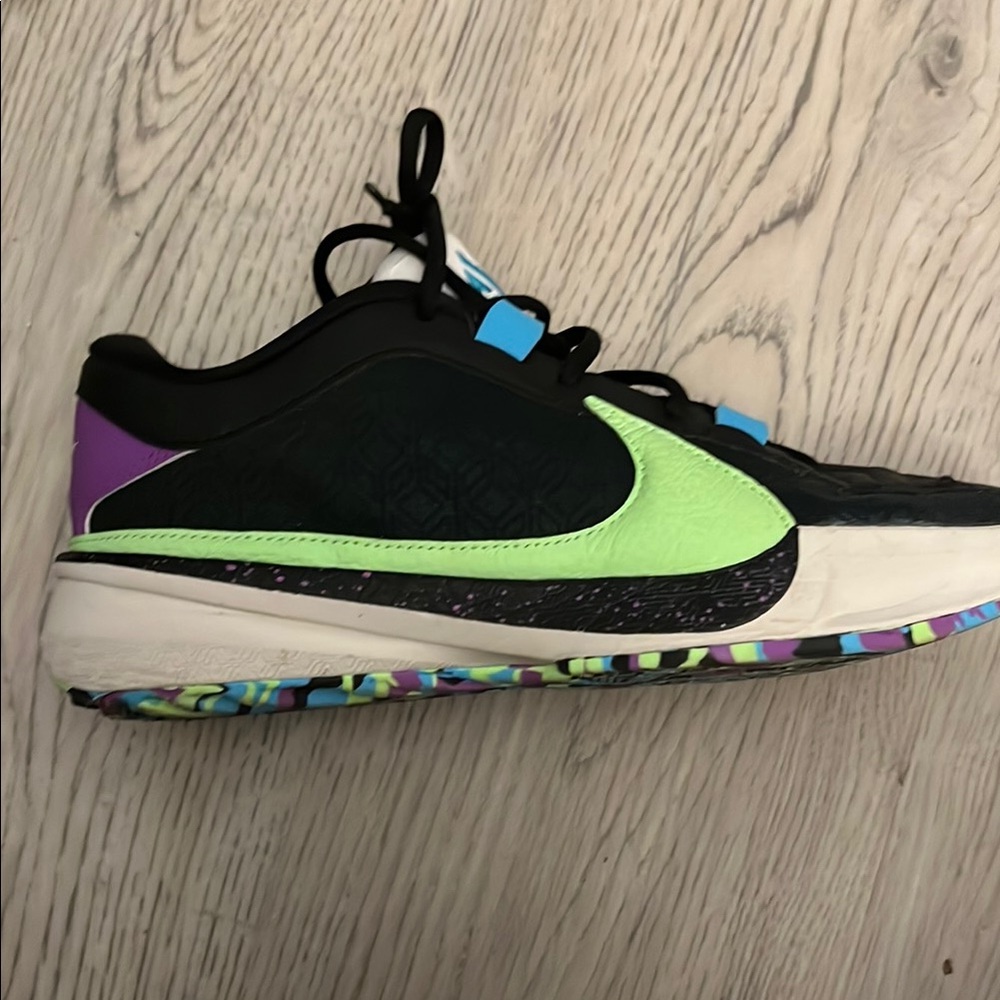 Black and Green Nike Sneakers with Mesh Upper and Colorful Sole